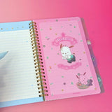 An officially licensed Sanrio Pochacco spiral-bound notebook, featuring a glitter finish with gold stars and an illustration of Pochacco. Includes four distinct, colorful dividers and five different interior page designs.