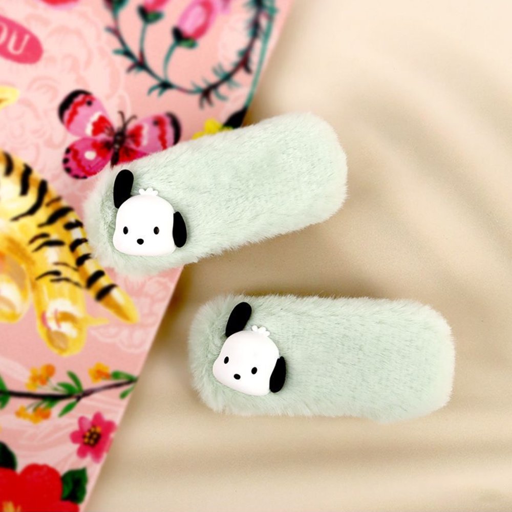 A pair of pastel green faux fur hair clips featuring 3D Sanrio Pochacco character charms with black ears.