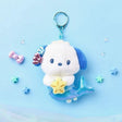 An officially licensed Sanrio character, Pochacco is reimagined with a shimmering metallic blue mermaid tail. The character is holding a small yellow starfish and has blue and pink shell accessories on its head, complete with a blue plastic clip.