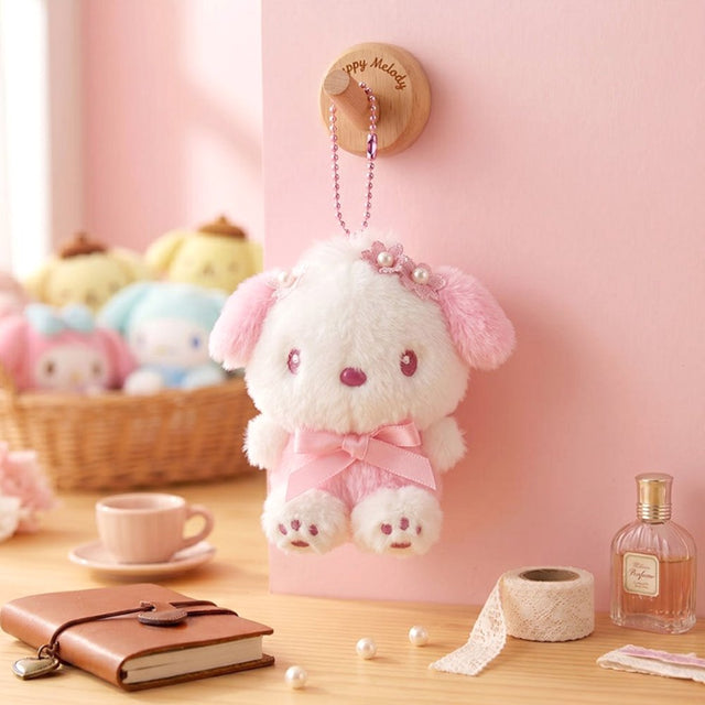 Officially licensed Sanrio Pochacco pink tone plush keychain styled in dreamy pastel pink and soft white hues with color-matched embroidered features, dangling from a ball chain