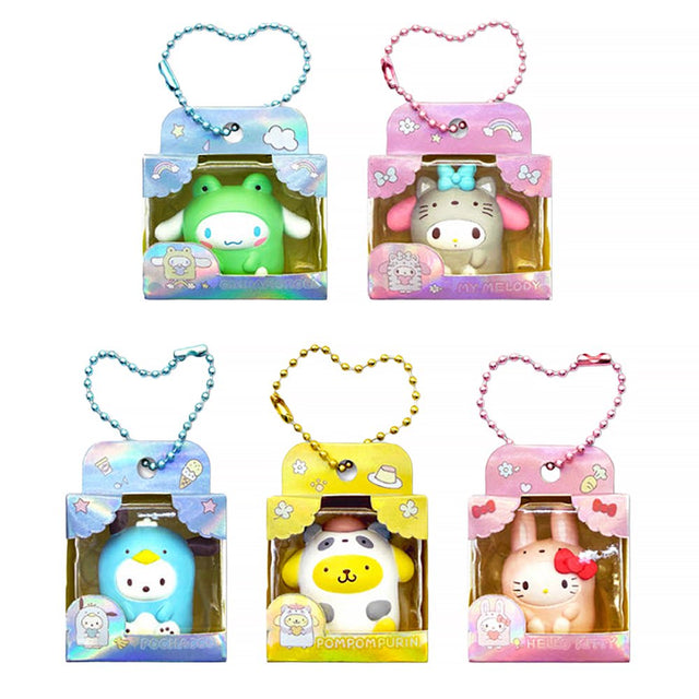 Five officially licensed Sanrio mini figures in colorful animal costumes, each packaged in a colorful box with a ball chain at the top. The collection includes Cinnamoroll, My Melody, Pochacco, Pompompurin, and Hello Kitty.