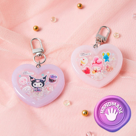 Officially licensed Sanrio handmade heart-shaped water shaker keychains in pastel pink featuring My Melody and pastel purple featuring Kuromi