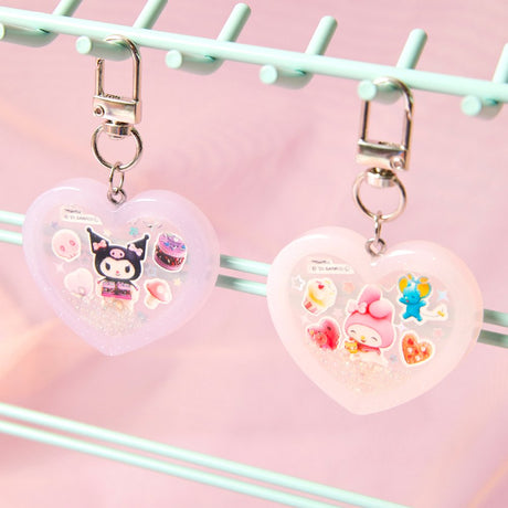 Officially licensed Sanrio handmade heart-shaped water shaker keychains in pastel pink featuring My Melody and pastel purple featuring Kuromi