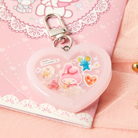 Officially licensed Sanrio handmade heart-shaped water shaker keychains in pastel pink featuring My Melody and pastel purple featuring Kuromi