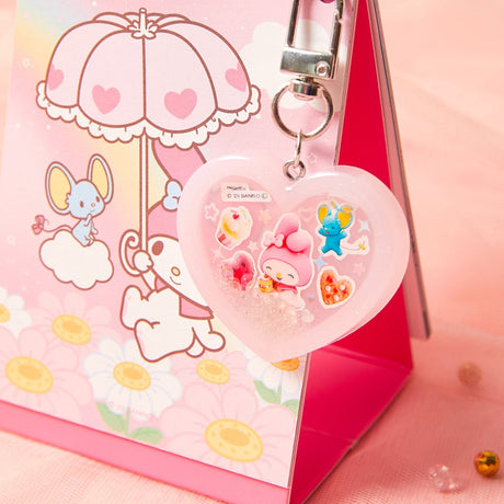 Officially licensed Sanrio handmade heart-shaped water shaker keychains in pastel pink featuring My Melody and pastel purple featuring Kuromi