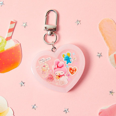 Officially licensed Sanrio handmade heart-shaped water shaker keychains in pastel pink featuring My Melody and pastel purple featuring Kuromi