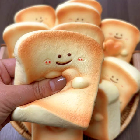 Realistic slice-of-bread squishy stress toy with a sweet smiling face and golden crust