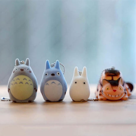 Officially licensed Studio Ghibli My Neighbor Totoro Big Totoro, Medium Totoro, Small Totoro, and Catbus keychain figures each with ball chain, featuring a soft fuzzy texture.