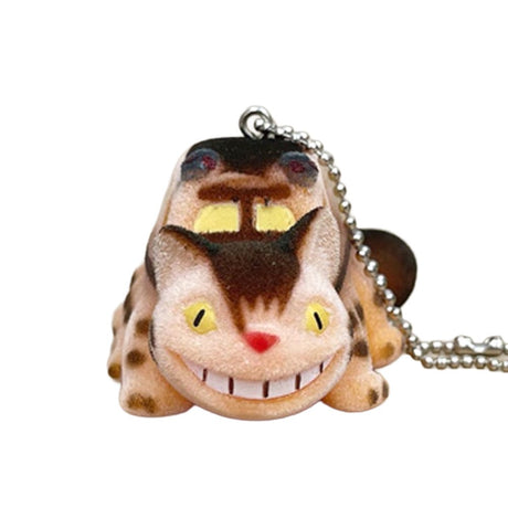 Officially licensed Studio Ghibli Catbus flocked keychain figure with a fuzzy texture, yellow glowing eyes, and wide grin, featuring a silver ball chain.