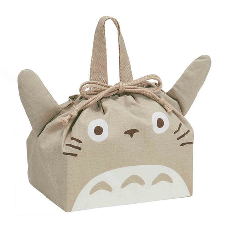 Officially licensed My Neighbor Totoro die-cut drawstring lunch pouch featuring 3D ears, Totoro's face, a drawstring tie, and top handles on natural beige fabric
