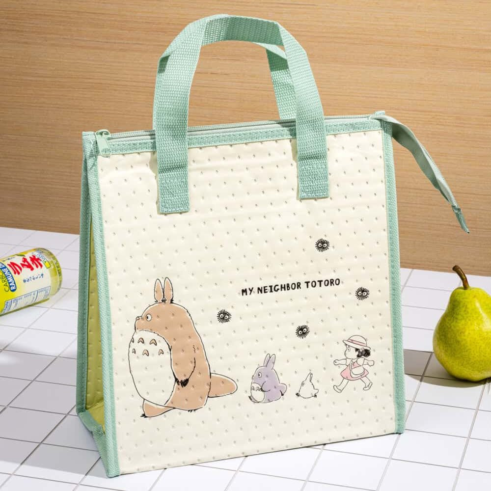 Officially licensed My Neighbor Totoro Skater insulated tote bag in cream and sage green featuring Totoro, Mei, and soot sprites on the front