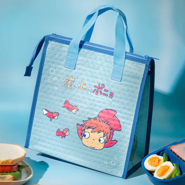 Officially licensed Ponyo Skater insulated tote bag in bright sky blue with dark blue trim, featuring Ponyo and her sisters swimming with bubbles