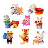 A collection of eight officially licensed Sylvanian Families baby figures in DIY themes, including a cat with a hammer, a giraffe with a paint roller, and a rabbit in a paint bucket. A pink question mark silhouette represents the eighth mystery figure in the series.