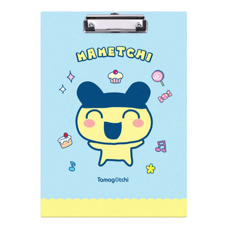 Two officially licensed Tamagotchi clipboards: one light blue featuring Mametchi with cupcakes and sweets, and one pale yellow featuring Kuchipatchi with stars and snacks. Both clipboards include a silver metal clip and the official Tamagotchi logo.