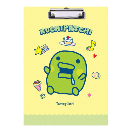 Two officially licensed Tamagotchi clipboards: one light blue featuring Mametchi with cupcakes and sweets, and one pale yellow featuring Kuchipatchi with stars and snacks. Both clipboards include a silver metal clip and the official Tamagotchi logo.
