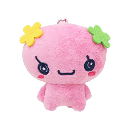Officially licensed Tamagotchi plush keychain of the character Floritchi, featuring a pink body with yellow and green felt flower accessories on its head and a ball-chain attachment for bags or keys.