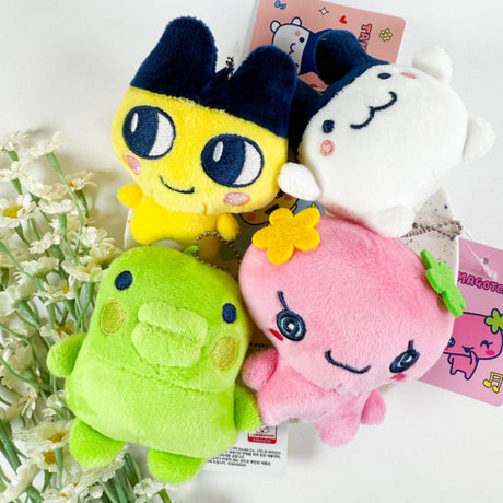 Officially licensed Tamagotchi plush keychain set of the character Mametchi, Floritchi, Mimitchi, and Kuchipatchi each with a ball-chain attachment for bags or keys.
