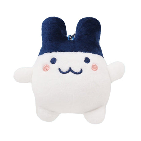 Officially licensed Tamagotchi plush keychain of the character Mimitchi, featuring a round white body, large navy blue ears, and a simple embroidered face with pink rosy cheeks and a "w" shaped mouth and a ball-chain attachment for bags or keys.