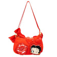 A vibrant red Betty Boop shoulder bag featuring a glossy patent red bow, heart appliqués, and iconic character graphics of Betty Boop and red lips, with a slim over-the-shoulder strap.