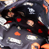 A vibrant red Betty Boop shoulder bag featuring a glossy patent red bow, heart appliqués, and iconic character graphics of Betty Boop and red lips, with a slim over-the-shoulder strap.