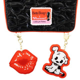 Black quilted heart-pattern backpack featuring Betty Boop and Pudgy character patches, vibrant red trim, and decorative gold chain charms shaped like red lips and Pudgy the dog.