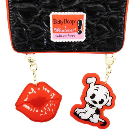 Black quilted heart-pattern backpack featuring Betty Boop and Pudgy character patches, vibrant red trim, and decorative gold chain charms shaped like red lips and Pudgy the dog.