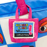 An officially licensed Burger Bargie large blue tote bag featuring a character's face with large eyes and a smile. The bag has bright pink padded handles and is decorated with small patches above the character's hair line.