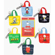Set of small tote bags with Peanuts character designs on a white background