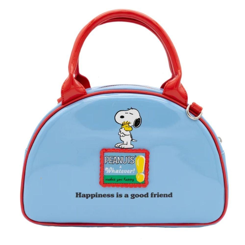 A light blue dome-shaped Snoopy crossbody bowler bag featuring Snoopy sitting on his red doghouse against a cloudy sky, with red handles, a striped rainbow shoulder strap, and a red heart-shaped Woodstock charm.