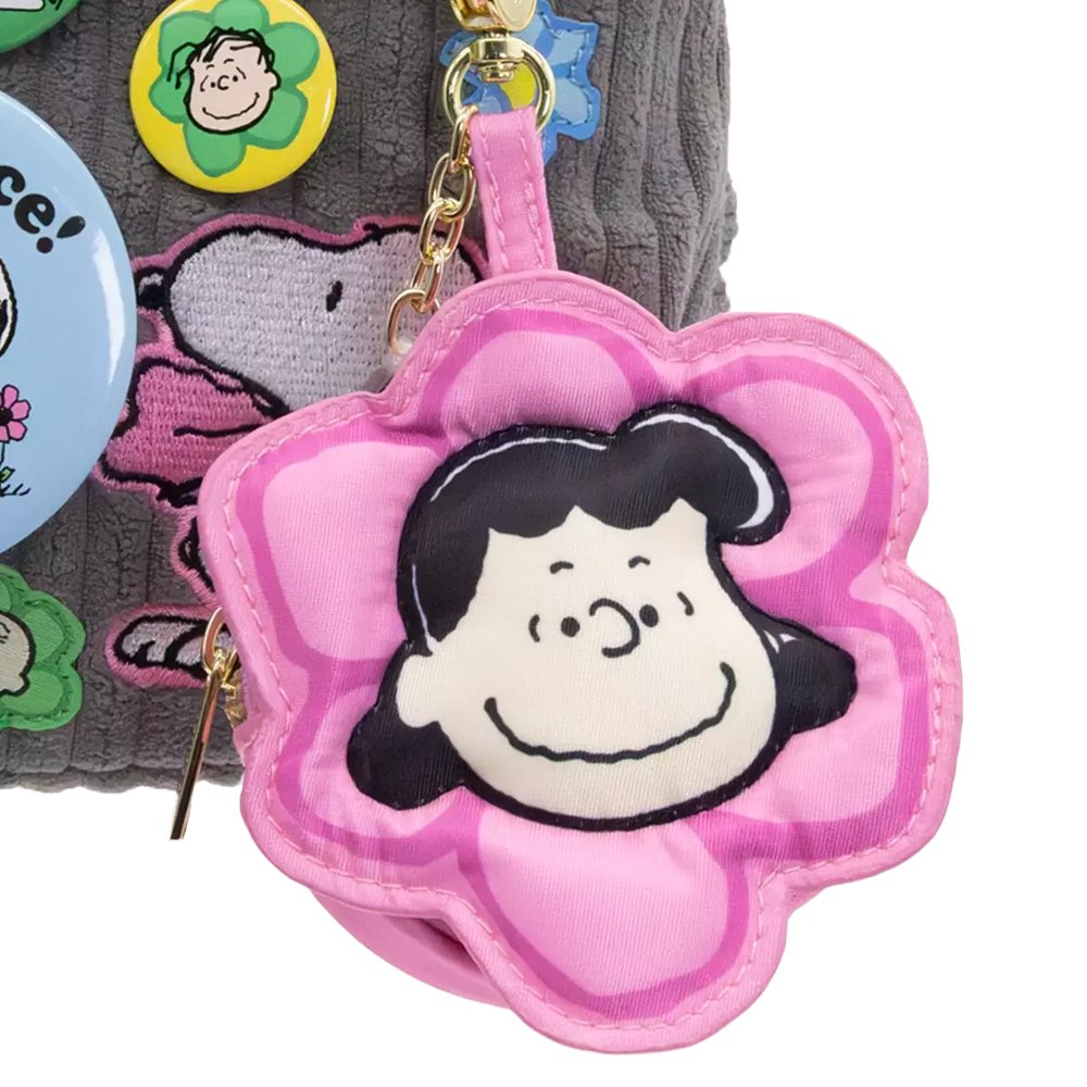 A collection of six colorful, flower-shaped Peanuts character pouch charms showcasing Snoopy, Woodstock, Charlie Brown, Lucy, Sally, and Linus
