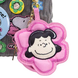 A collection of six colorful, flower-shaped Peanuts character pouch charms showcasing Snoopy, Woodstock, Charlie Brown, Lucy, Sally, and Linus
