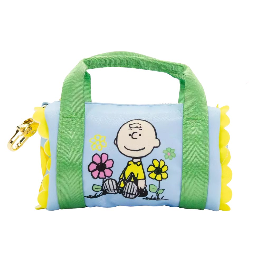 Six miniature duffle-shaped Peanuts character coin pouches in assorted bright pastel colors and floral patterns showcasing characters like Snoopy holding flowers, Woodstock, Lucy, and Charlie Brown