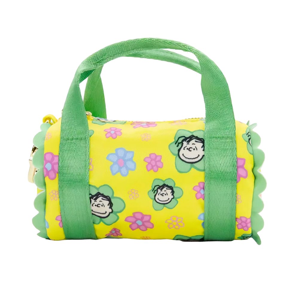 Six miniature duffle-shaped Peanuts character coin pouches in assorted bright pastel colors and floral patterns showcasing characters like Snoopy holding flowers, Woodstock, Lucy, and Charlie Brown