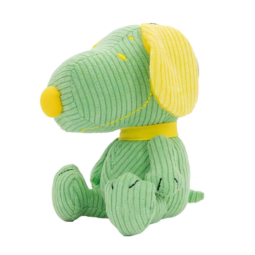 Six colorful, mini corduroy Snoopy plush charms in various pastel hues arranged around a pink mystery box