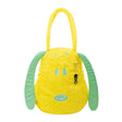 A bright yellow corduroy tote bag shaped like Snoopy's head with long, floppy green ears, subtle embroidered yellow flowers on the face, and a hanging black Peanuts keychain charm
