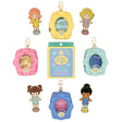A collection of Polly Pocket mystery items including four colorful character enamel pins and four flower-shaped miniature bag charm keychains in yellow, pink, blue, and mint green.