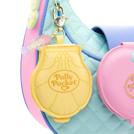 A collection of six Polly Pocket mystery mirror compact bag charms in various shapes of heart, star, shell, and flower and pastel shades of purple, pink, blue, yellow, green, and orange. The charms feature gold lobster clips and acrylic character tags.