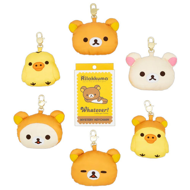 An officially licensed collection of Rilakkuma mystery plush keychains include Rilakkuma with various expressions, Korilakkuma, Kiiroitori, and characters wearing bear-themed hoods. Each plush features a gold-tone lobster clasp.