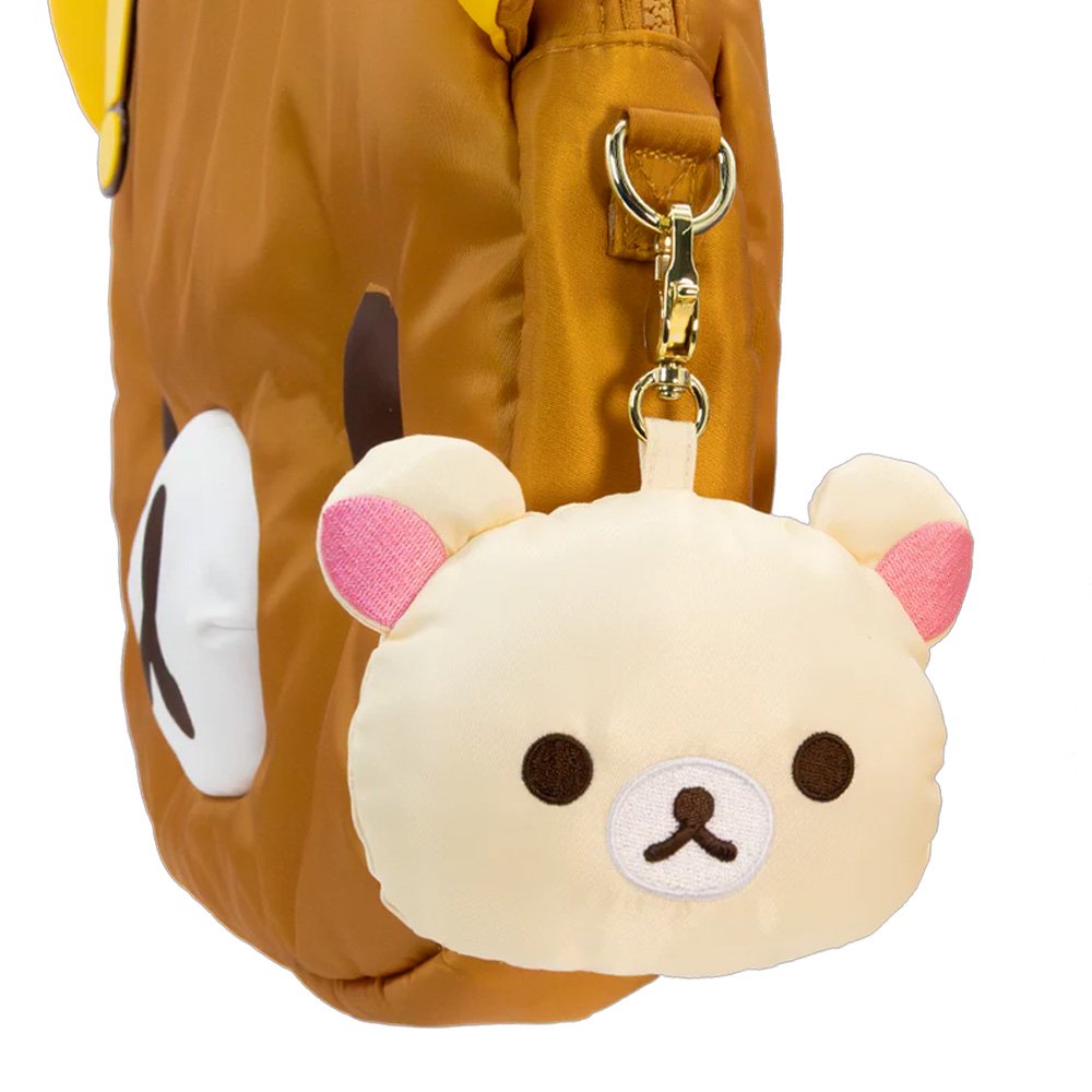 An officially licensed collection of Rilakkuma mystery plush keychains include Rilakkuma with various expressions, Korilakkuma, Kiiroitori, and characters wearing bear-themed hoods. Each plush features a gold-tone lobster clasp.