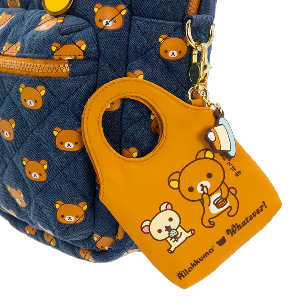 A collection of officially licensed Rilakkuma mystery keychains in a variety of colors. Each keychain is shaped like a small tote bag featuring Rilakkuma and a "have a nice day!" message, and each includes a unique food-themed charm like pancakes or pudding.
