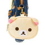 An officially licensed Korilakkuma puffy crossbody bag in an ivory color, shaped like the character's head with round ears. The bag includes a detachable ivory shoulder strap with gold-tone hardware.