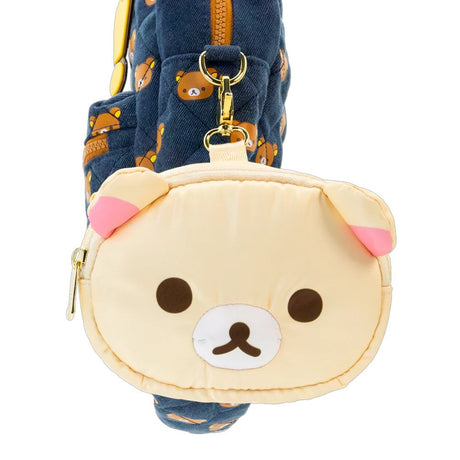 An officially licensed Korilakkuma puffy crossbody bag in an ivory color, shaped like the character's head with round ears. The bag includes a detachable ivory shoulder strap with gold-tone hardware.