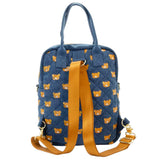 An officially licensed Rilakkuma reversible quilted backpack in navy denim blue. The front features a repeating pattern of Rilakkuma's face and a zippered front pocket.