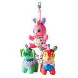 Four colorful, retro-style plush animal bag charms dressed as circus clowns by artist So Lazo, shown hanging together from a metal clip with a logo ribbon strap
