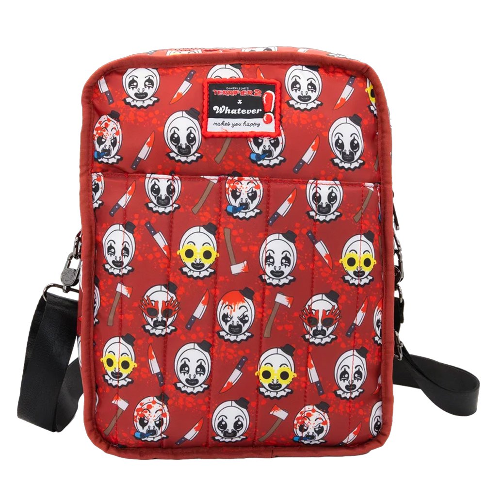 Reversible and convertible horror movie Terrifier 2 tote bag showcasing a split black-and-white design with red blood splatters, a bloody meat cleaver bag charm, and an Art the Clown charm