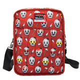 Reversible and convertible horror movie Terrifier 2 tote bag showcasing a split black-and-white design with red blood splatters, a bloody meat cleaver bag charm, and an Art the Clown charm