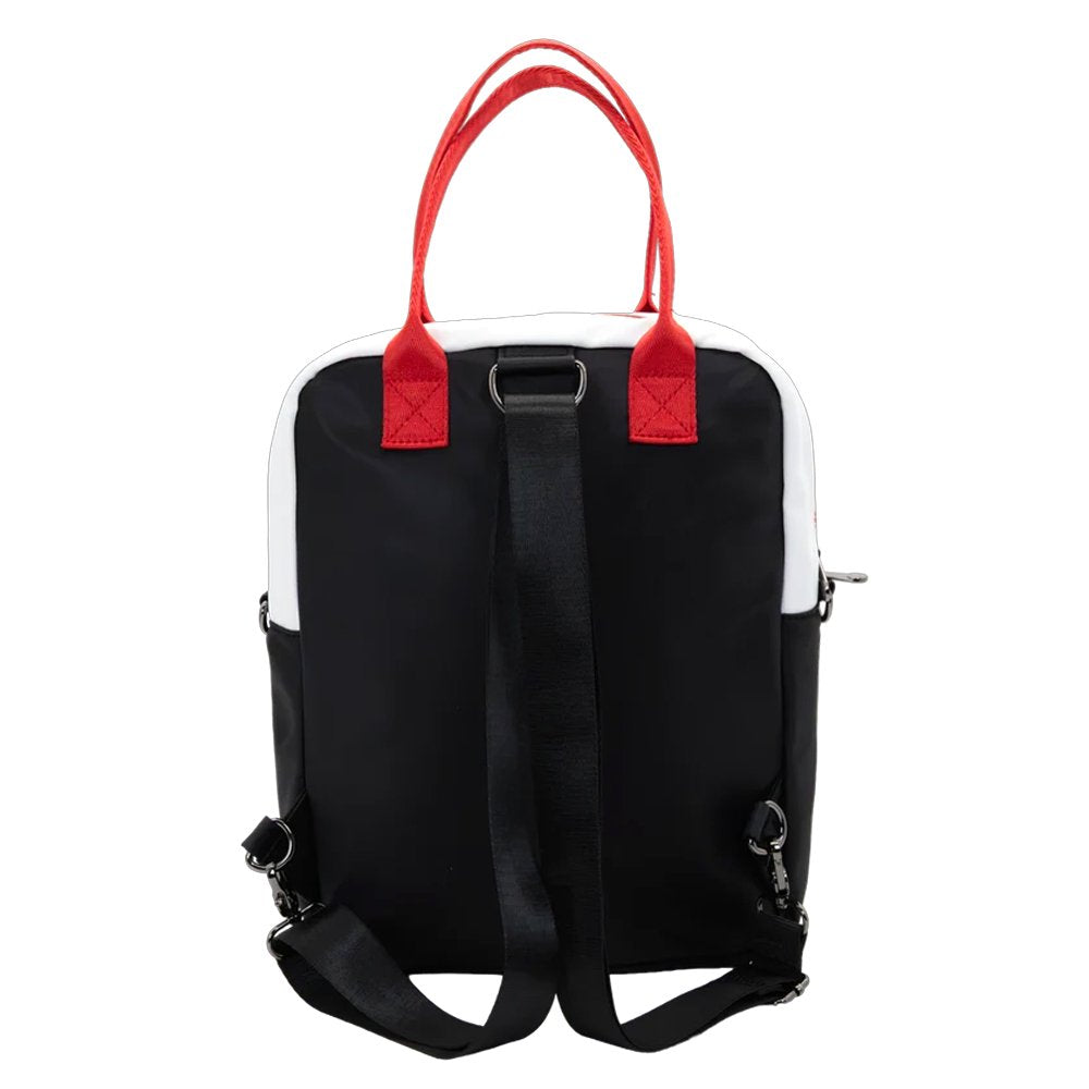 Reversible and convertible horror movie Terrifier 2 tote bag showcasing a split black-and-white design with red blood splatters, a bloody meat cleaver bag charm, and an Art the Clown charm