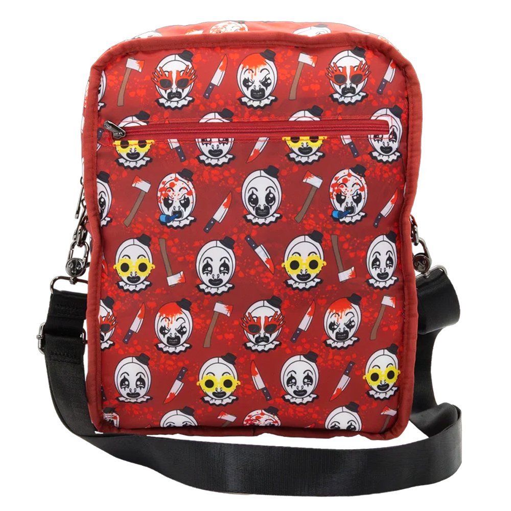 Reversible and convertible horror movie Terrifier 2 tote bag showcasing a split black-and-white design with red blood splatters, a bloody meat cleaver bag charm, and an Art the Clown charm