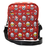 Reversible and convertible horror movie Terrifier 2 tote bag showcasing a split black-and-white design with red blood splatters, a bloody meat cleaver bag charm, and an Art the Clown charm