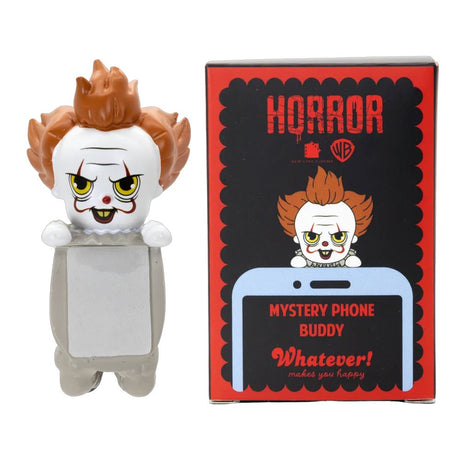 Six Warner Bros horror mystery blind box phone buddy mini figures lined up featuring Annabelle, The Nun, Regan, Pennywise, David, one secret Chase style